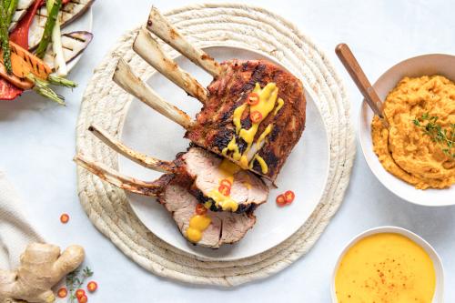 Rack of veal with a mango sauce, grilled vegetables and sweet potato mash