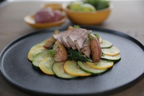 Veal eye of round steak with spinach and zucchini