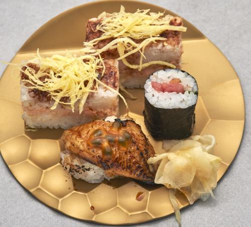 Oishi sushi / Nigiri unagi und Kalbfleisch-Maki in form von Shake-Maki