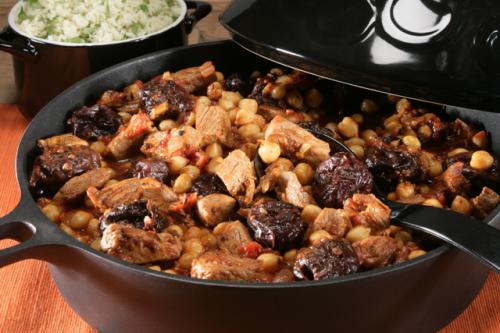 Mediterranean veal tagine with chickpeas, plums, Moroccan herbs, couscous and fresh coriander