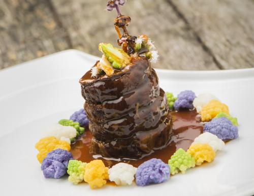 Braised roasting veal roulade with orange and ginger, and colourful cauliflower