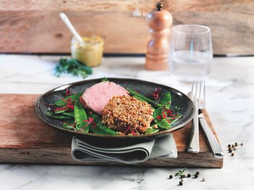 Veal medallions with a sesame crust and sugar snaps